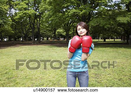 Woman who does a boxing-exercise View Large Photo Image Stock Photo - Woman who does a boxing-exercise. Fotosearch