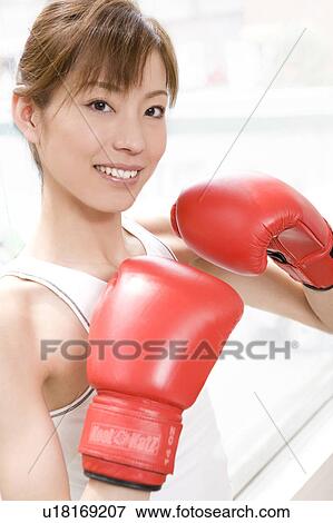 Woman who does a boxing-exercise View Large Photo Image Stock Photo - Woman who does a boxing-exercise. Fotosearch
