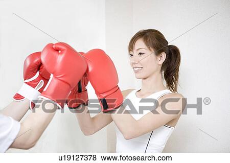 Woman who does a boxing-exercise View Large Photo Image Stock Photo - Woman who does a boxing-exercise. Fotosearch