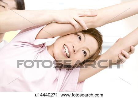 Stock Image - Woman who does stretching. Fotosearch