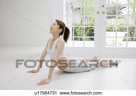 Stock Image - Woman who does stretching. Fotosearch