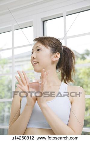 Woman who drinks water View Large Photo Image Stock Image - Woman who drinks water. Fotosearch