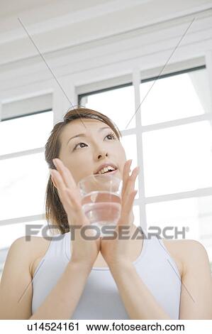 Woman who drinks water View Large Photo Image Stock Image - Woman who drinks water. Fotosearch