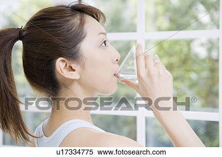 Stock Photography - Woman who drinks water. Fotosearch