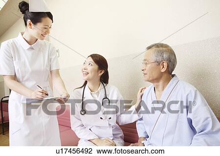 Doctor and patient having a pleasant chat View Large Photo Image Stock Image - Doctor and patient having a pleasant chat. Fotosearch