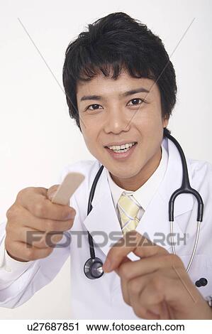 Doctor examining View Large Photo Image Stock Image - Doctor examining. Fotosearch
