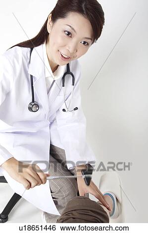 Doctor examining View Large Photo Image Stock Photograph - Doctor examining. Fotosearch
