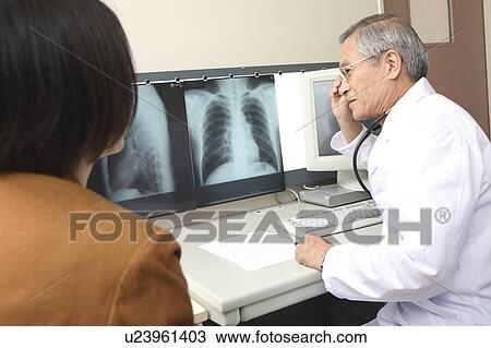 Stock Image - Doctor explaining. Fotosearch