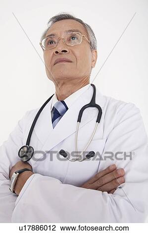 Stock Image - Doctor folding his arms. Fotosearch