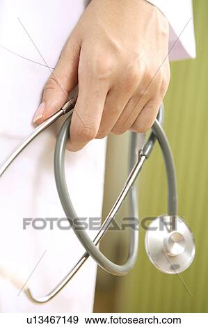 Hand having a stethoscope View Large Photo Image Stock Photo - Hand having a stethoscope. Fotosearch