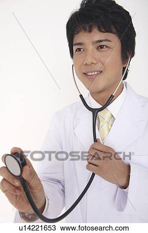 Physician having a stethoscope View Large Photo Image Stock Image - Physician having a stethoscope. Fotosearch