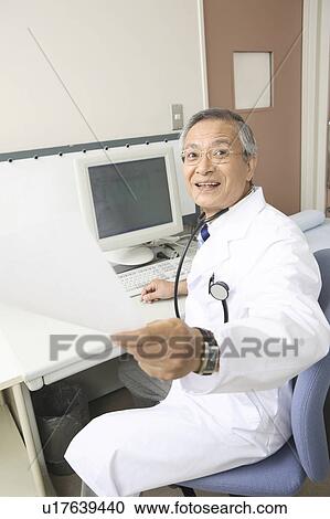 Stock Image - Physician looking back. Fotosearch