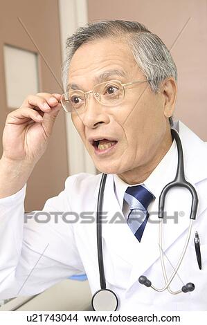 Physician wearing glasses View Large Photo Image Picture - Physician wearing glasses. Fotosearch