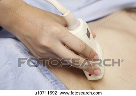 Stock Image - Abdomen inspection. Fotosearch