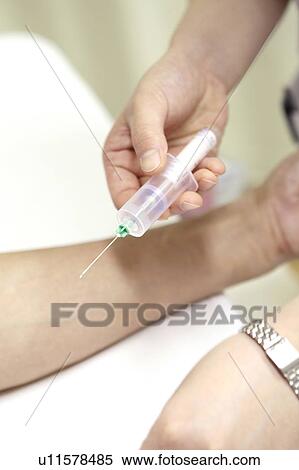 Stock Photography - Hand collecting blood. Fotosearch