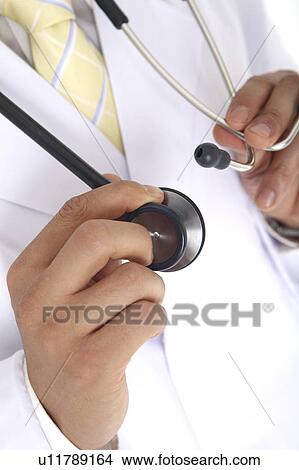 Picture - Hand having a stethoscope. Fotosearch