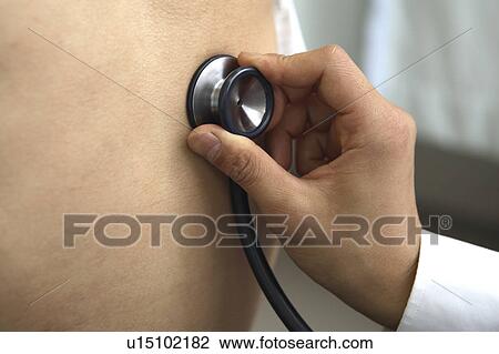 Stock Image - Hand having a stethoscope. Fotosearch