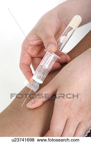 Hand having a syringe View Large Photo Image Stock Photo - Hand having a syringe. Fotosearch