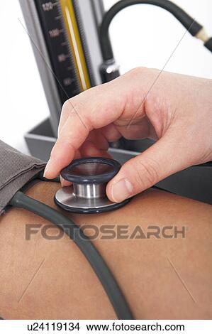 Hand measuring blood pressure View Large Photo Image Picture - Hand measuring blood pressure. Fotosearch