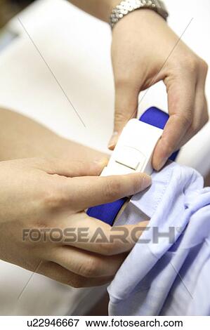 Hand of fastening a belt View Large Photo Image Stock Photo - Hand of fastening a belt. Fotosearch