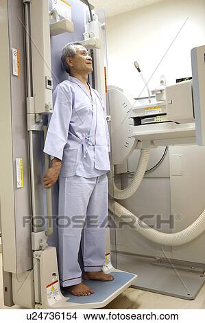 Picture - Man examined by X-ray. Fotosearch