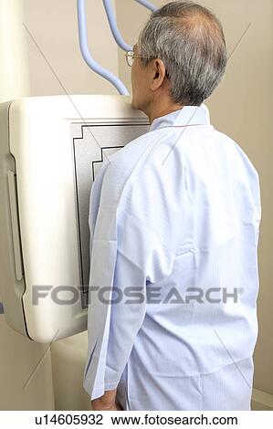 Stock Image - Man examined by X-ray. Fotosearch