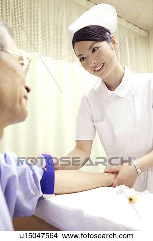 Picture - Nurse collecting blood. Fotosearch