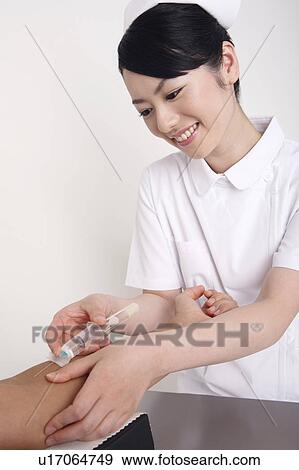 Nurse collecting blood View Large Photo Image Stock Photo - Nurse collecting blood. Fotosearch