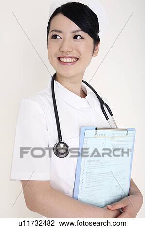 Nurse having a patient's record View Large Photo Image Stock Image - Nurse having a patient's record. Fotosearch