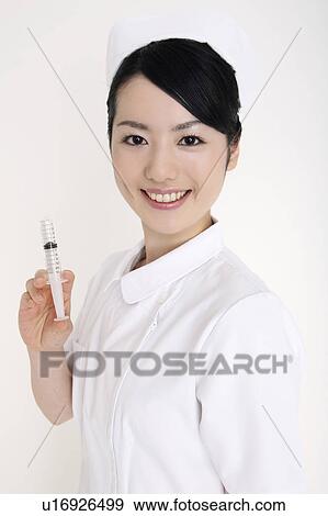 Stock Photo - Nurse having a syringe. Fotosearch