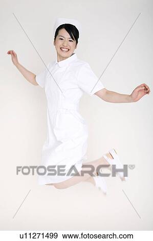 Stock Photo - Nurse jumping. Fotosearch