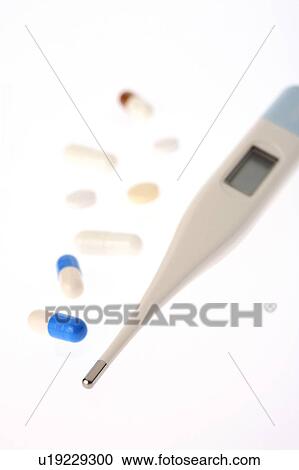 Stock Image - Thermometer and medicine. Fotosearch