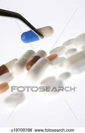 Tweezers and medicine View Large Photo Image Stock Photo - Tweezers and medicine. Fotosearch