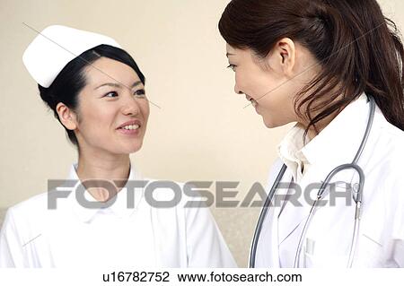 Stock Image - Doctor and nurse. Fotosearch