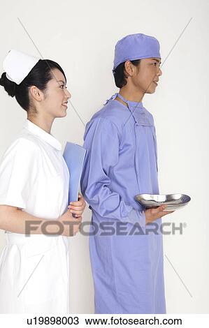 Stock Image - Doctor and nurse. Fotosearch