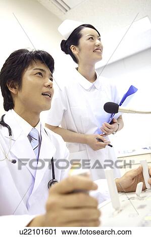 Stock Image - Doctor and nurse. Fotosearch