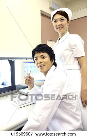 Stock Photo - Doctor and nurse. Fotosearch