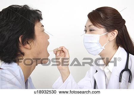 Doctor examining View Large Photo Image Stock Image - Doctor examining. Fotosearch