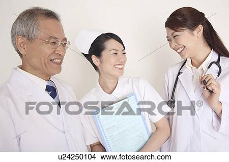 Smiling doctor and nurse View Large Photo Image Picture - Smiling doctor and nurse. Fotosearch