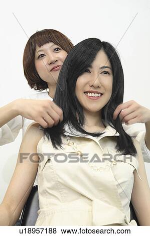 Beautician and woman View Large Photo Image Stock Photo - Beautician and woman. Fotosearch