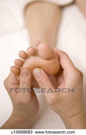 Stock Image - Foot massage. Fotosearch
