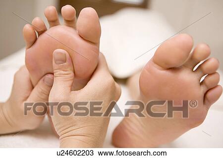 Stock Image - Foot massage. Fotosearch