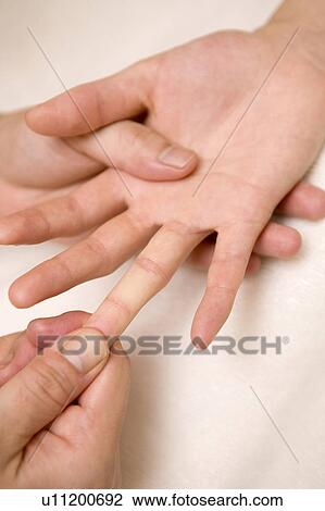 Massage of the finger View Large Photo Image Stock Image - Massage of the finger. Fotosearch