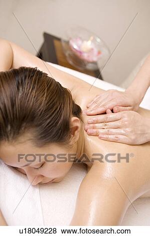Woman having massage View Large Photo Image Stock Photo - Woman having massage. Fotosearch