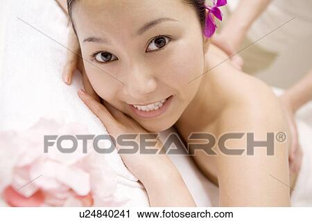 Stock Image - Woman receiving a beauty treatment. Fotosearch