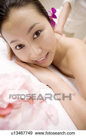 Woman receiving a beauty treatment View Large Photo Image Stock Photo - Woman receiving a beauty treatment. Fotosearch