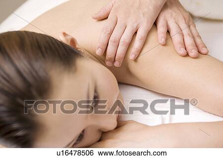Woman receiving a beauty treatment View Large Photo Image Stock Photograph - Woman receiving a beauty treatment. Fotosearch