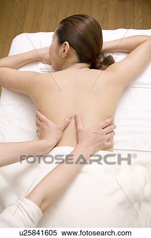 Stock Photography - Woman receiving a beauty treatment. Fotosearch