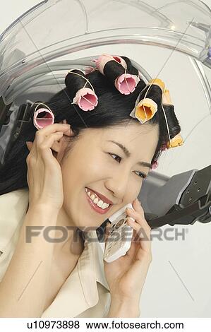 Woman to have a perm View Large Photo Image Stock Photo - Woman to have a perm. Fotosearch