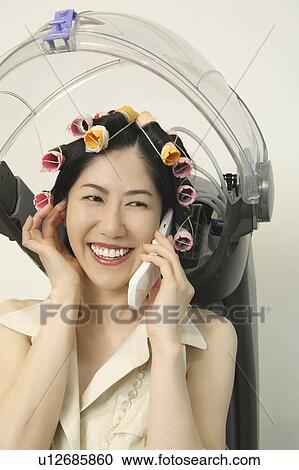 Stock Image - Woman who allots permanent. Fotosearch